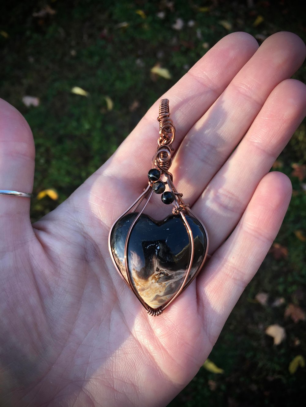 assorted fossilized palmroot heart necklaces