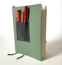 Image 1 of Book cover storage pocket