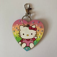 Image 2 of Rainbow heart glitter Hello Kitty hand painted wooden heart shaped keychain