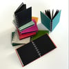 Small square spiral bound sketchbook (black pages)