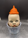 Startled Cupcake Baby with Orange Frosting