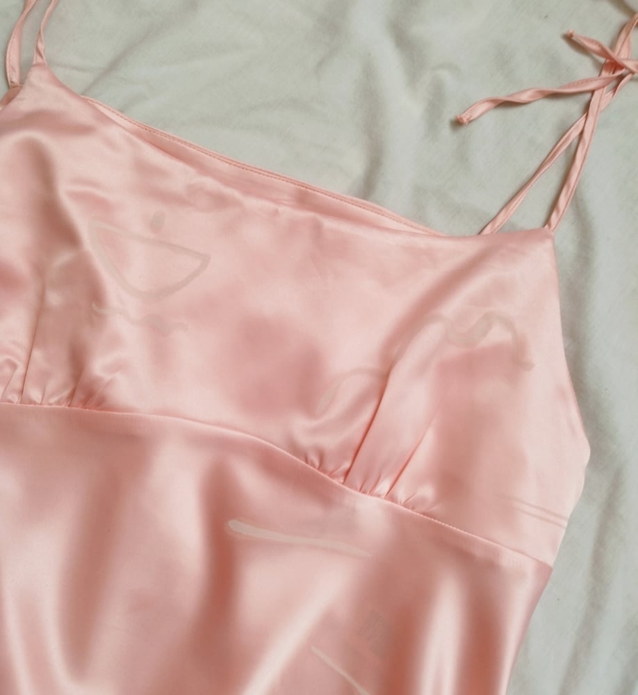 Image of pink linear cami top