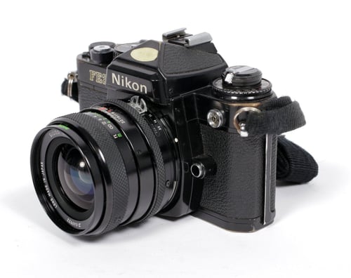 Image of Nikon FE2 35mm SLR Film Camera with Wide angle Sigma MC 28mm F2.8 lens #559