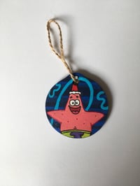Image 1 of SpongeBob SquarePants Patrick Star inspired hand painted wooden Christmas ornament.