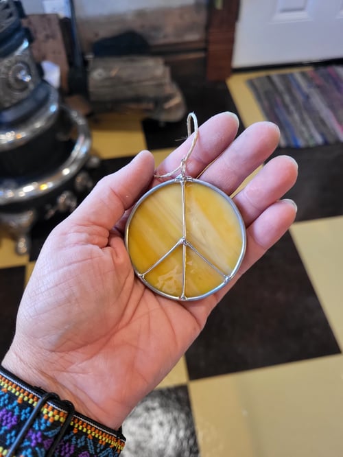 Image of M. peace sign - stained glass