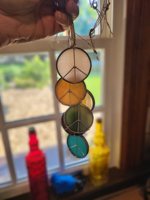 Image of M. peace sign - stained glass