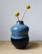 Image of blue on black bud vase