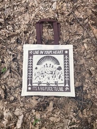 Brown Live In Your Heart tote bag.