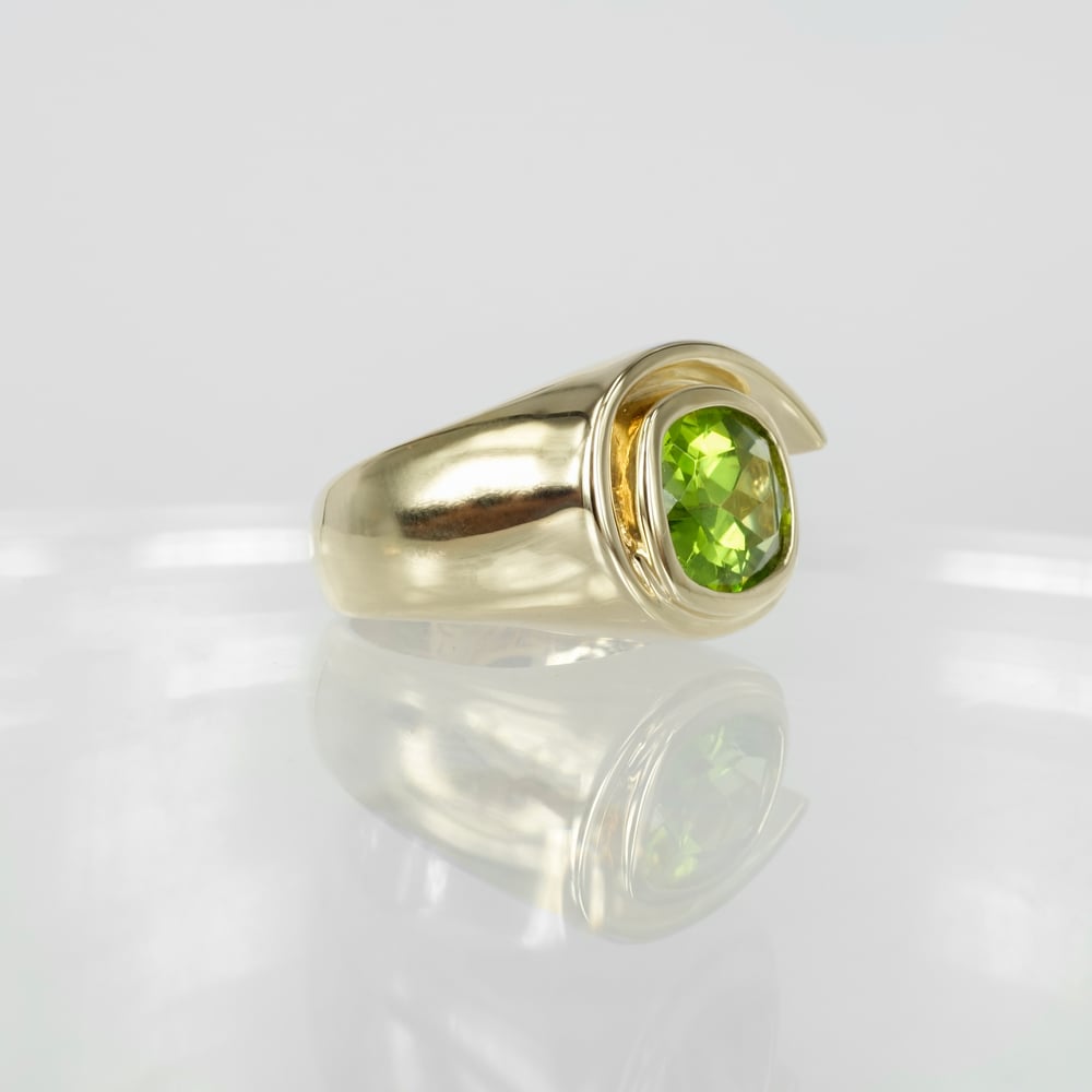 Image of Large 9ct yellow gold cocktail ring set with 3.74ct peridot. Pj5970