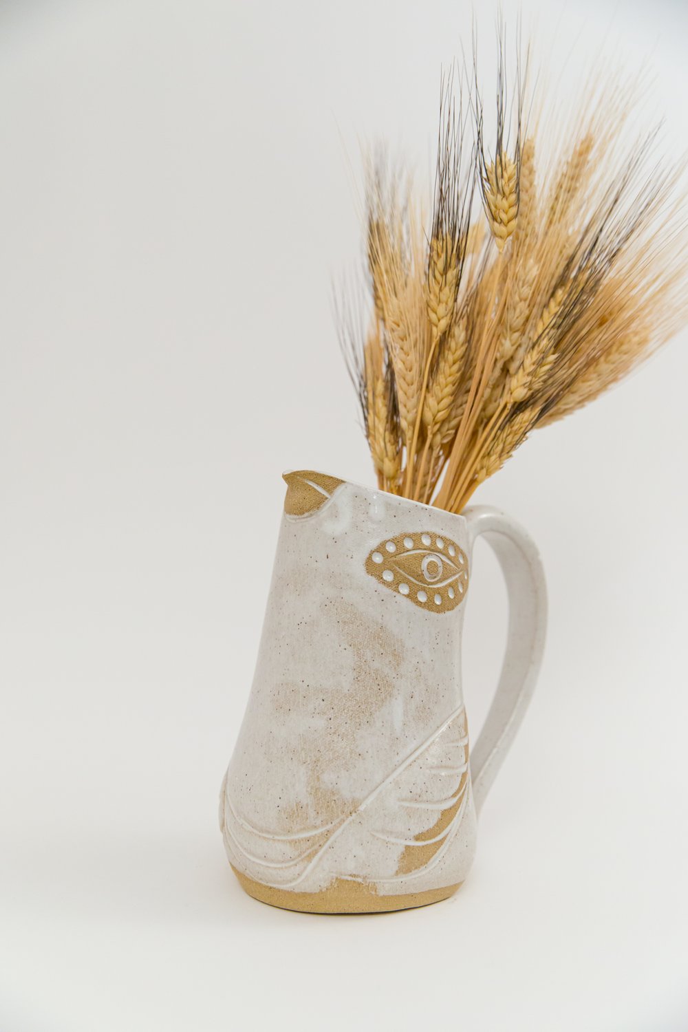 Image of Large Almond Dotted Eye Flying Family Size Pitcher
