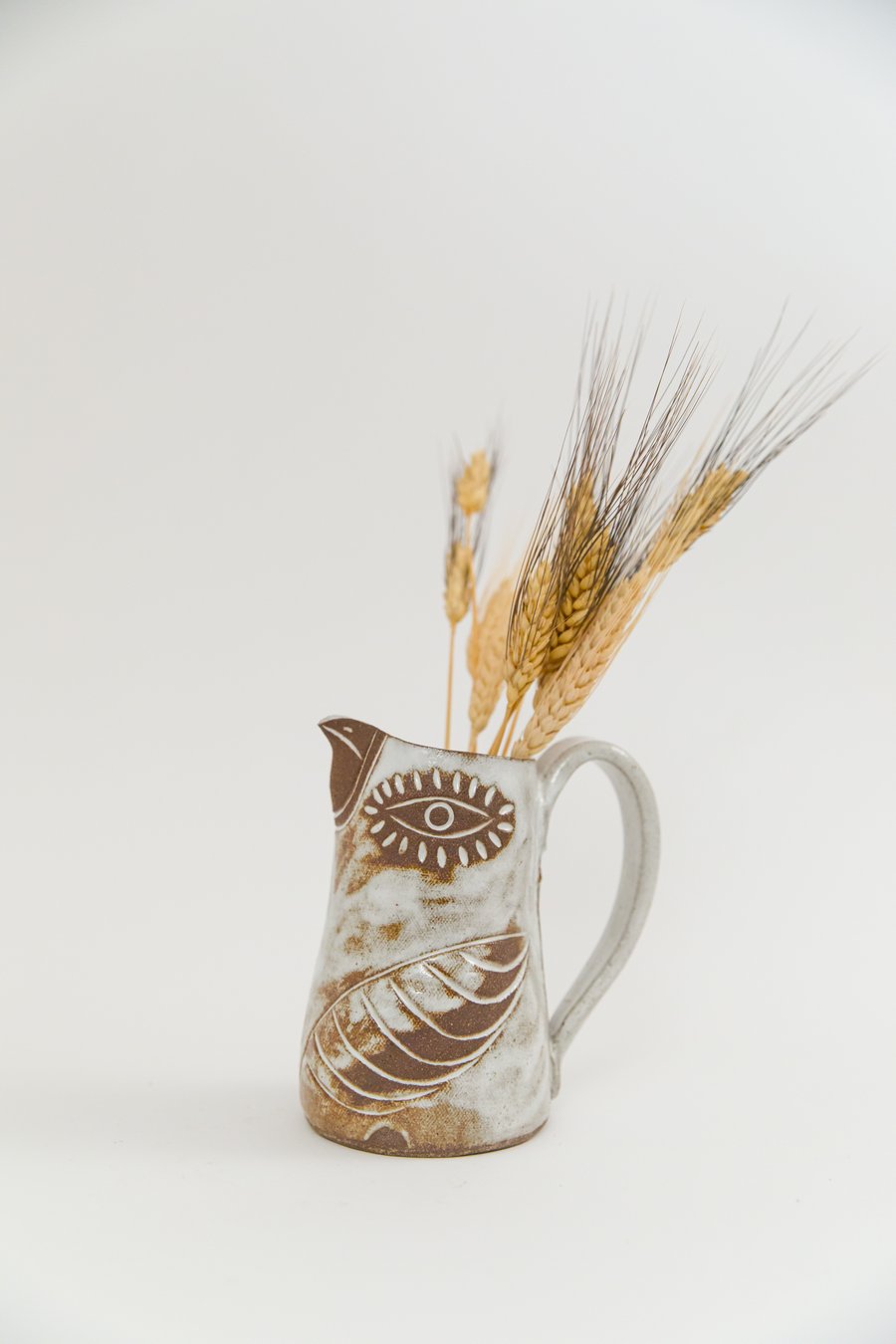 Image of Medium Brown Eyed Glossy White Flying Bird Pitcher