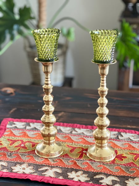 Image of Vintage brass candlestands with diamond cut emerald votives.