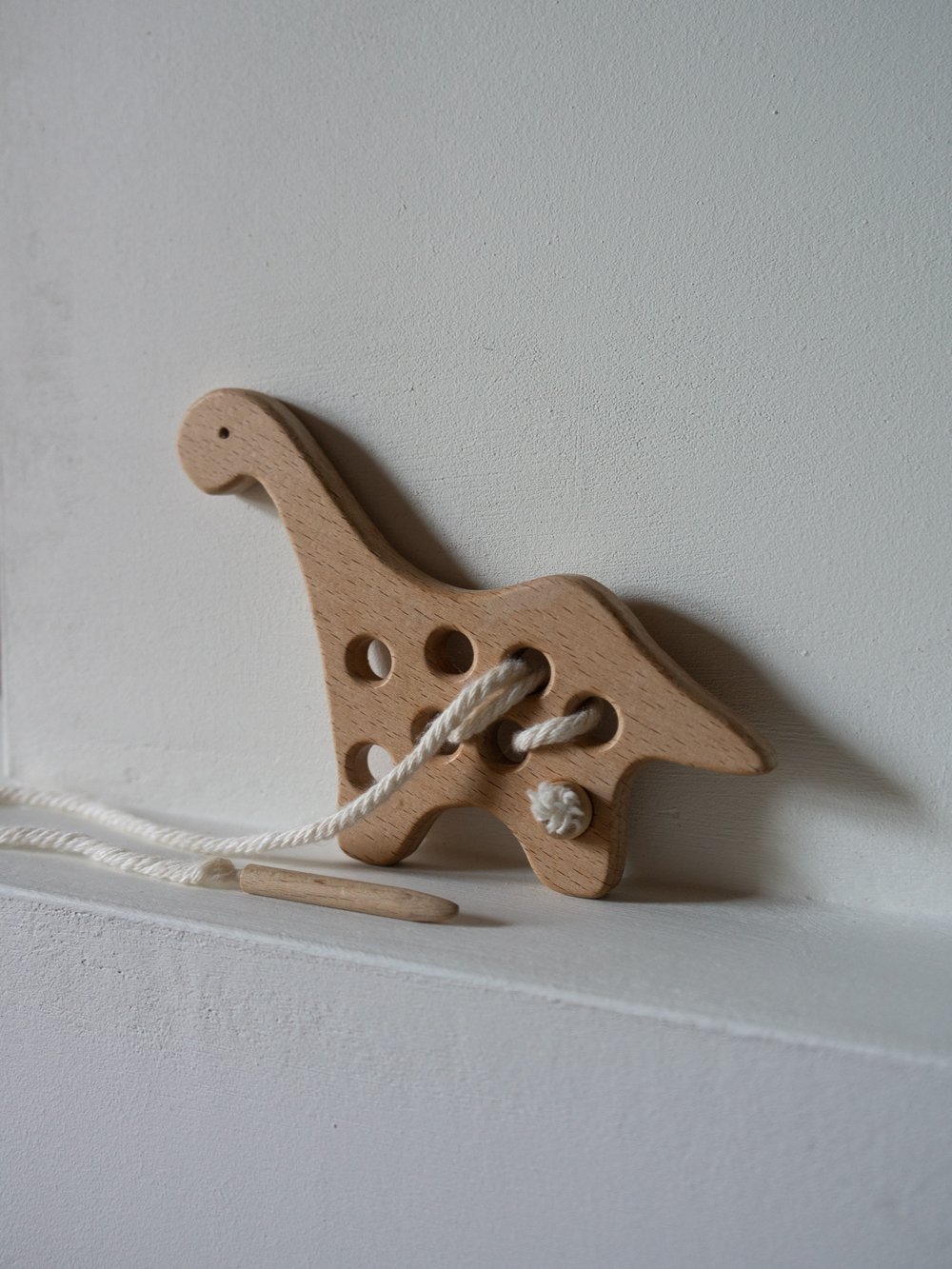 Image of dino lacing toy