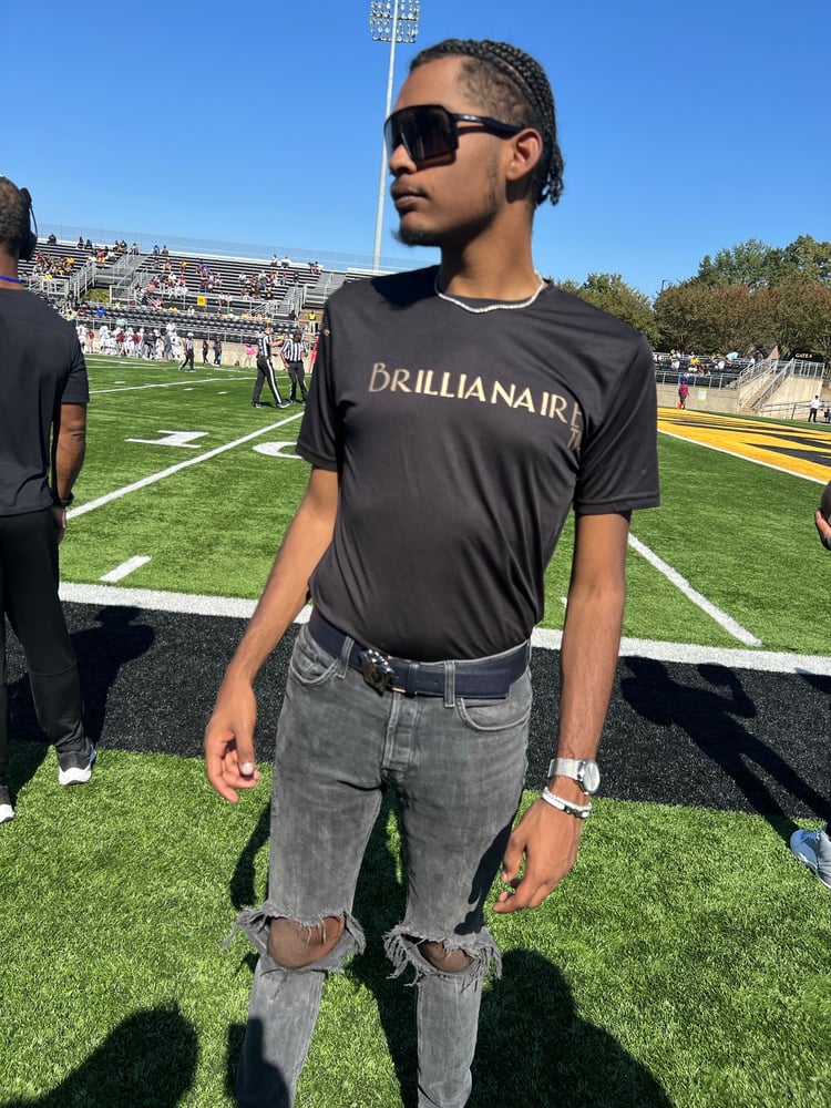 Image of feather tee