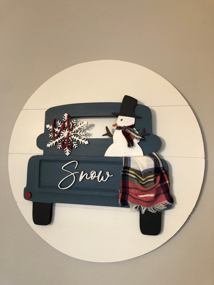 Image of Let it snow snowman truck on a 18” shiplap round background 