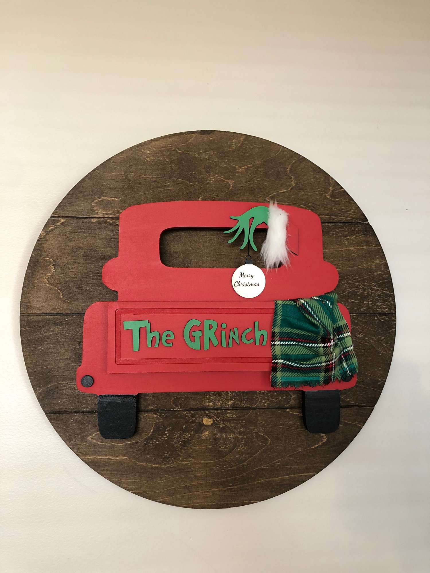 Image of The Grinch Truck on a 18” shiplap round background 