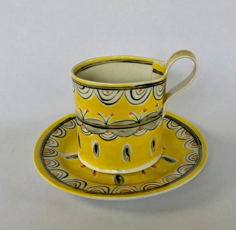 Image of Yellow pattern tea cup jug and plate