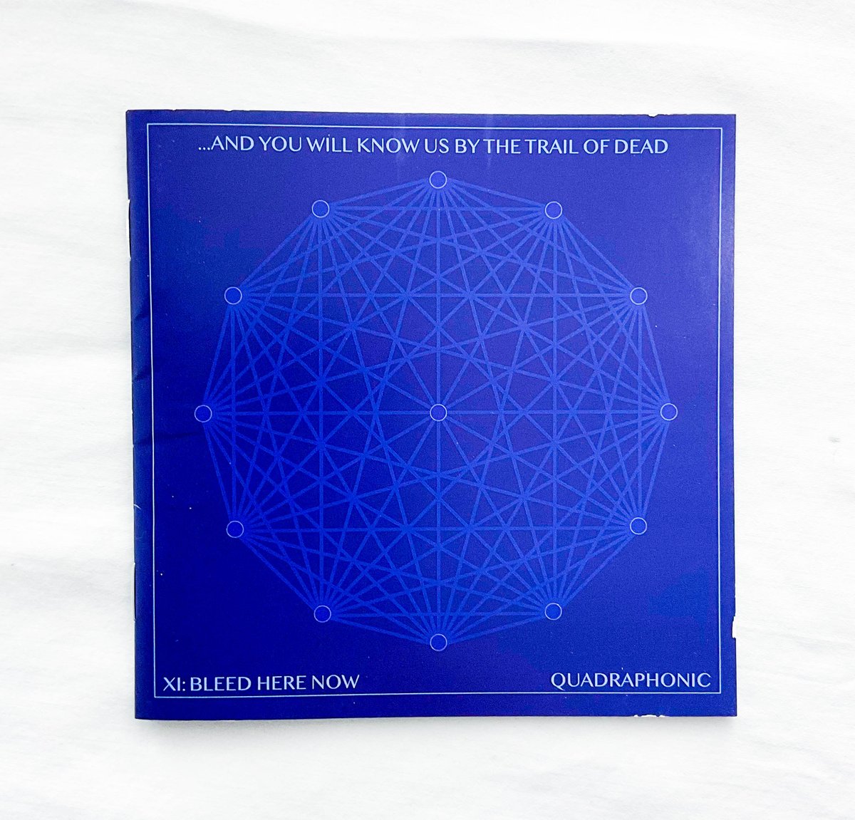 "XI: Bleed Here Now" Compact Disc