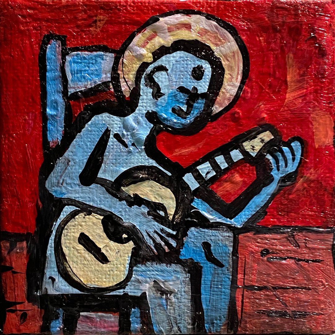 Image of haloed blue being tuning a guitar while sitting on blue chair in a red room with a wooden floor