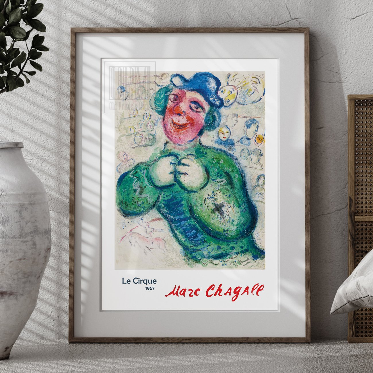 Marc Chagall Le Cirque 1967 poster with smiling clown in green costume and blue hat.