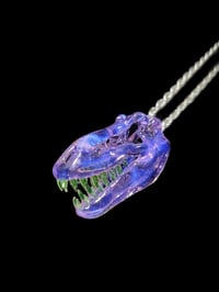 Image 1 of Rose quarts T-Rex skull pendant with illuminati teeth. 