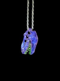 Image 3 of Rose quarts T-Rex skull pendant with illuminati teeth. 