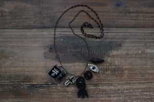 Image of Collana "Erbario in nero"