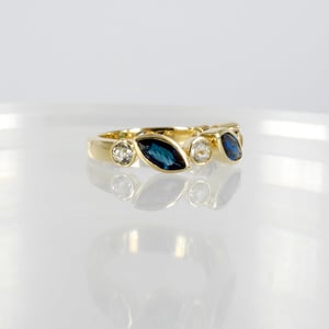 Image of 9ct yellow gold white and blue sapphire dress ring. PJ5950