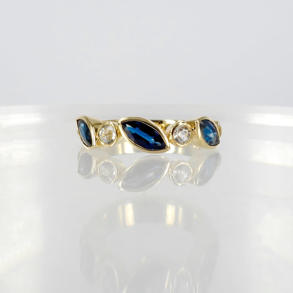 Image of 9ct yellow gold white and blue sapphire dress ring. PJ5950