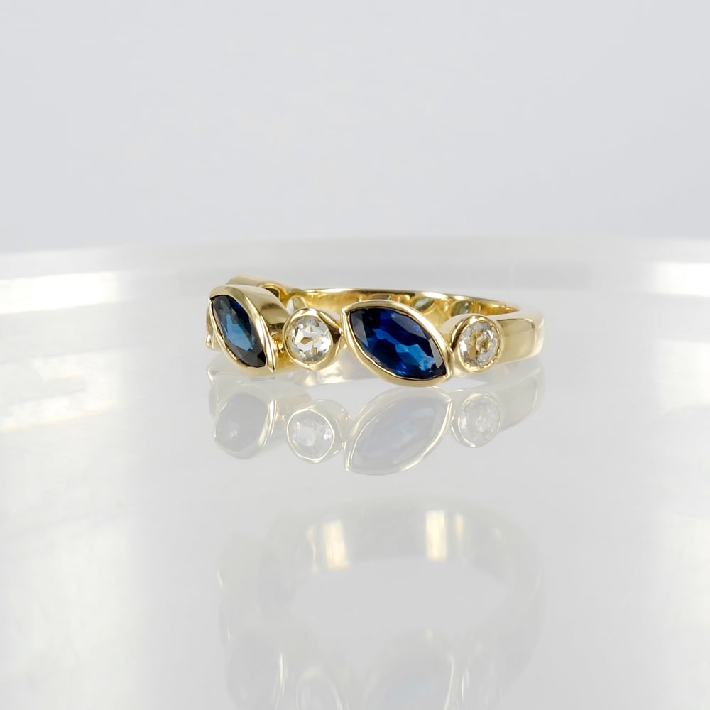 Image of 9ct yellow gold white and blue sapphire dress ring. PJ5950