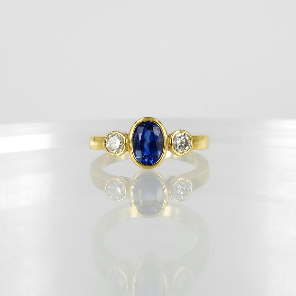 Image of 18ct yellow gold sapphire and diamond dress ring. PJ0406