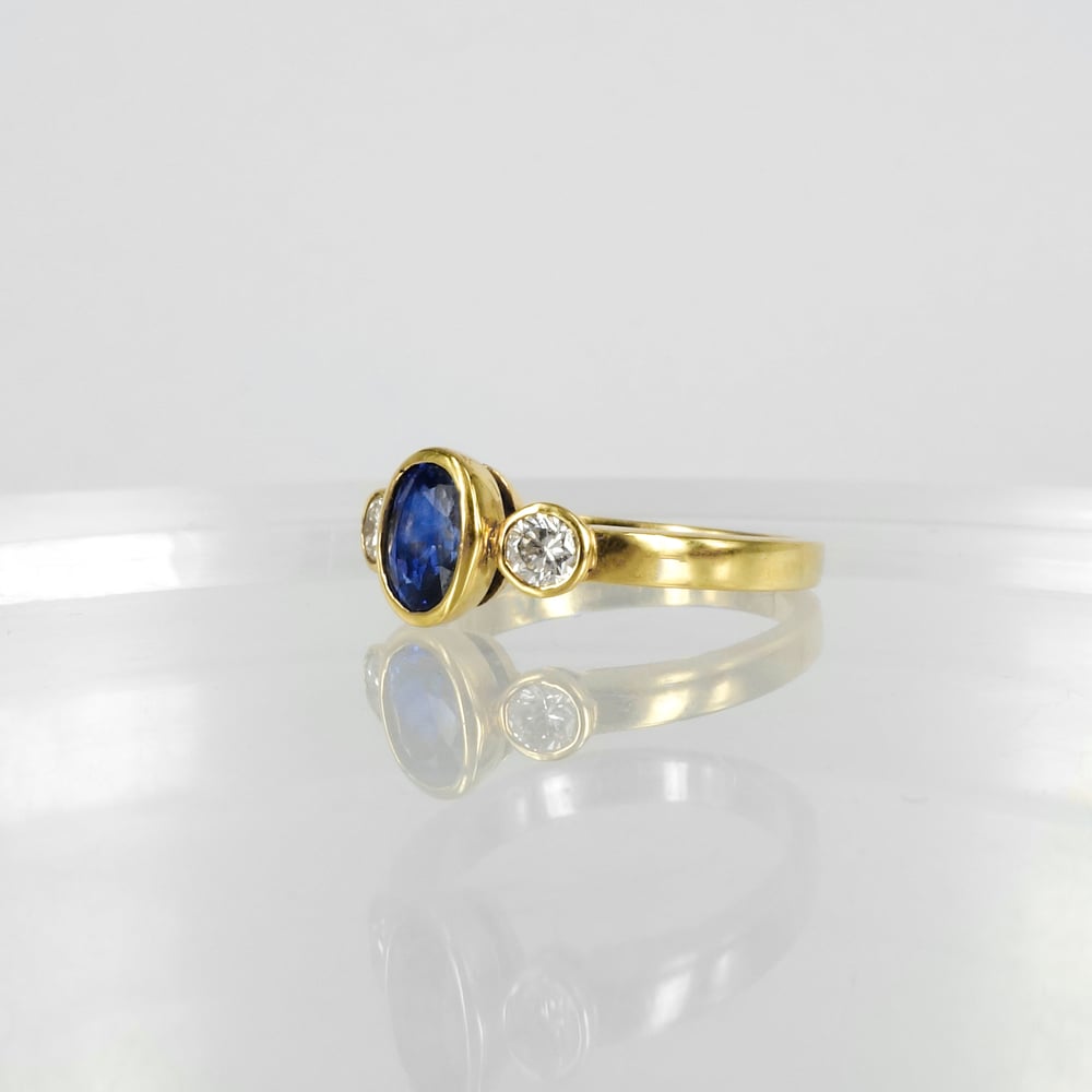 Image of 18ct yellow gold sapphire and diamond dress ring. PJ0406