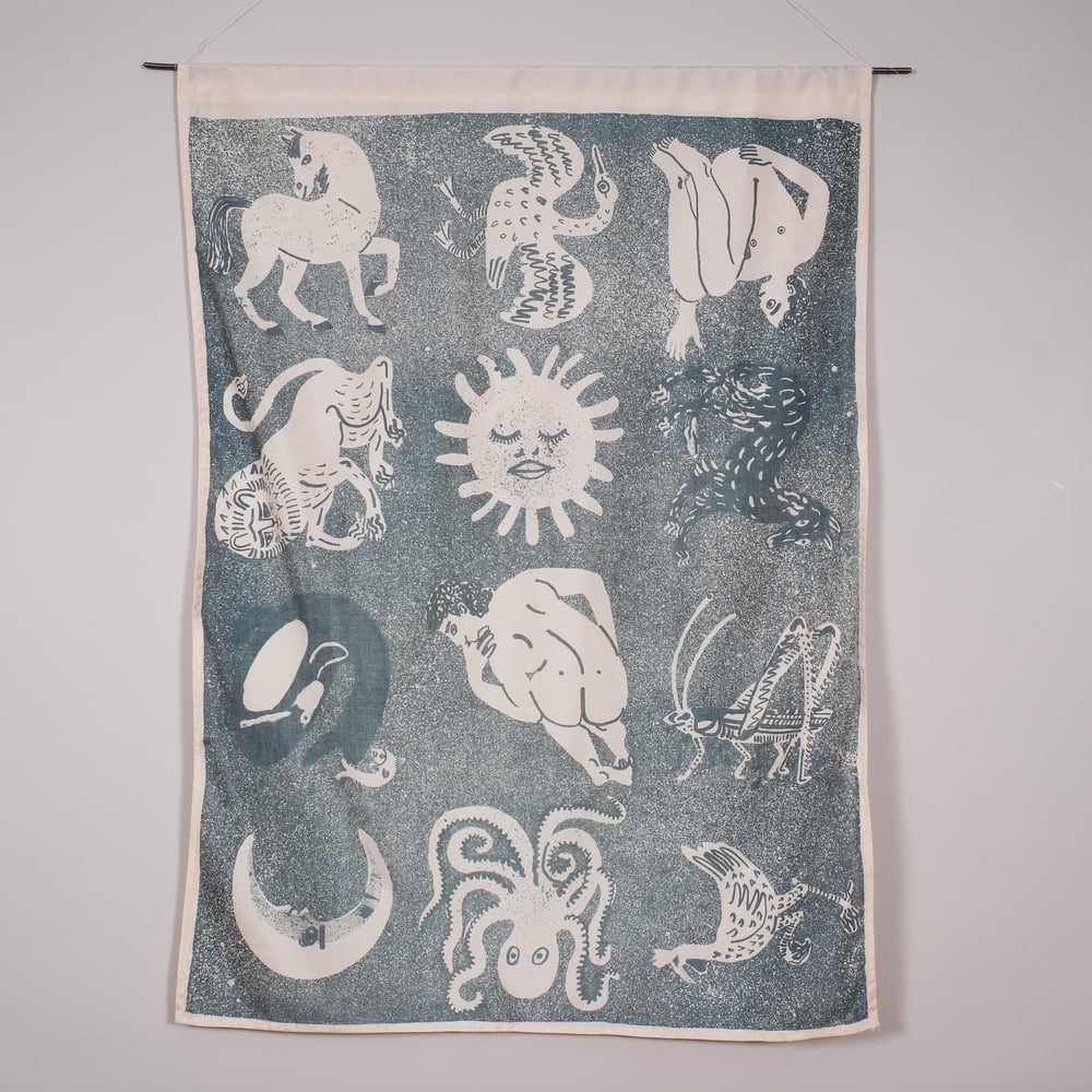 Lithographed beasts silk wall hanging - blue on cream