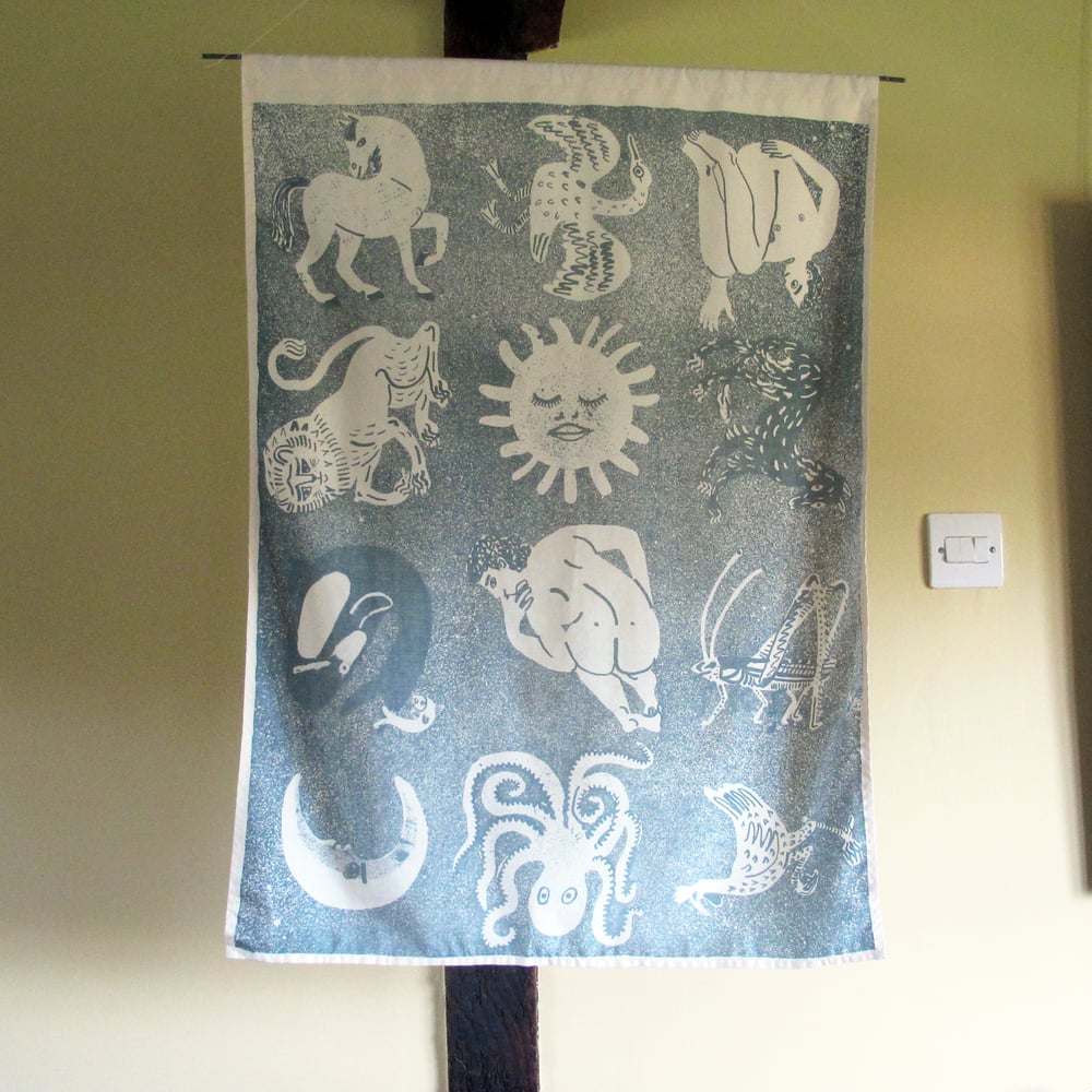 Lithographed beasts silk wall hanging - blue on cream