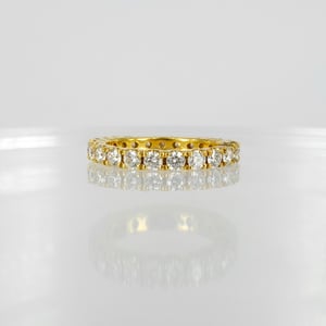 Image of 18ct yellow gold full circle diamond set ring.PJ4468