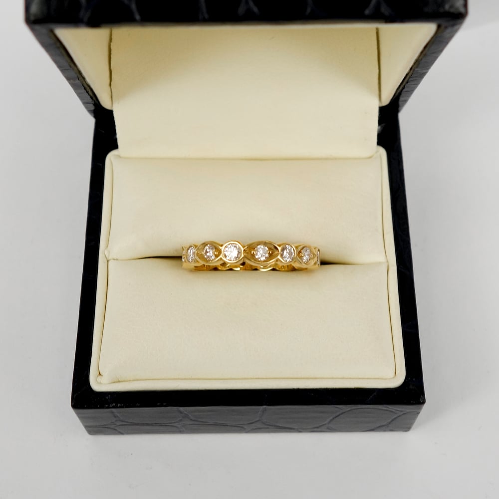 Image of 18ct yellow gold full circle diamond set celebration ring. PJ5395