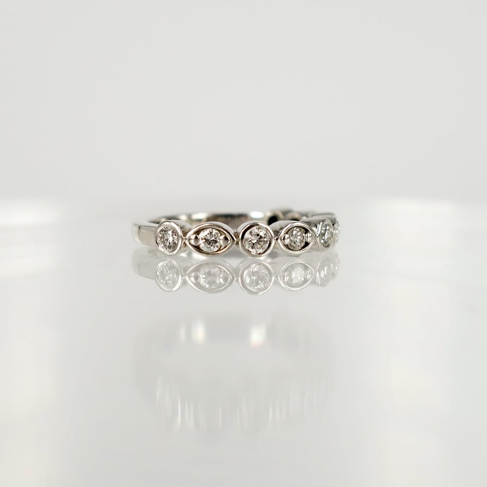 Image of 18ct white gold half diamond set celebration ring. PJ5878