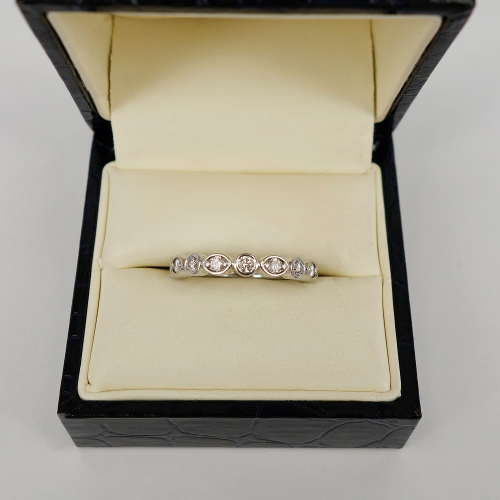 Image of 18ct white gold half diamond set celebration ring. PJ5878