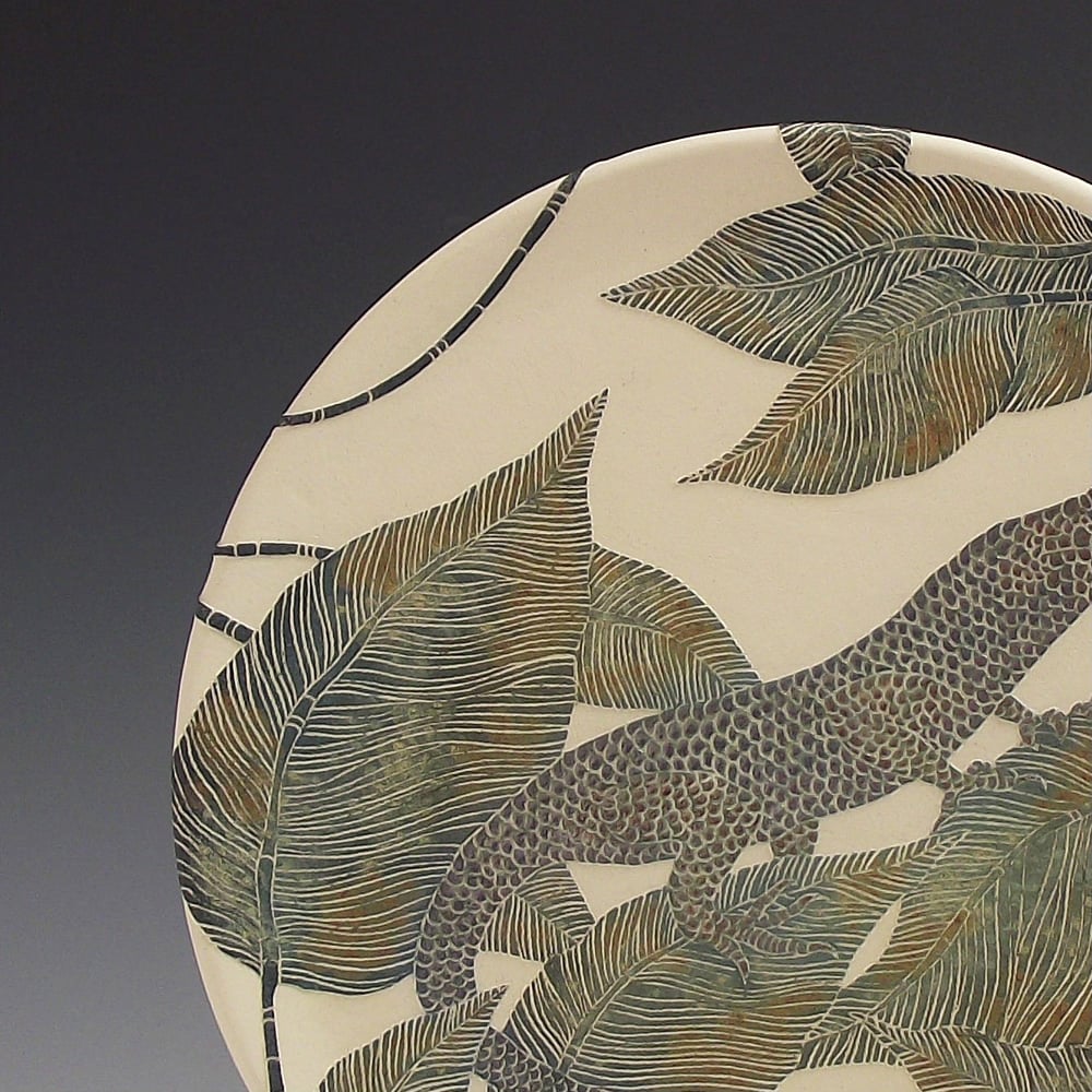 Image of Emerald skink & tropical leaves ceramic sgraffito wall art 