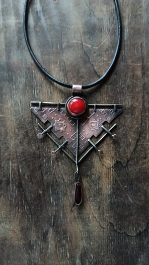 Copper ethnic pendant with red accents 
