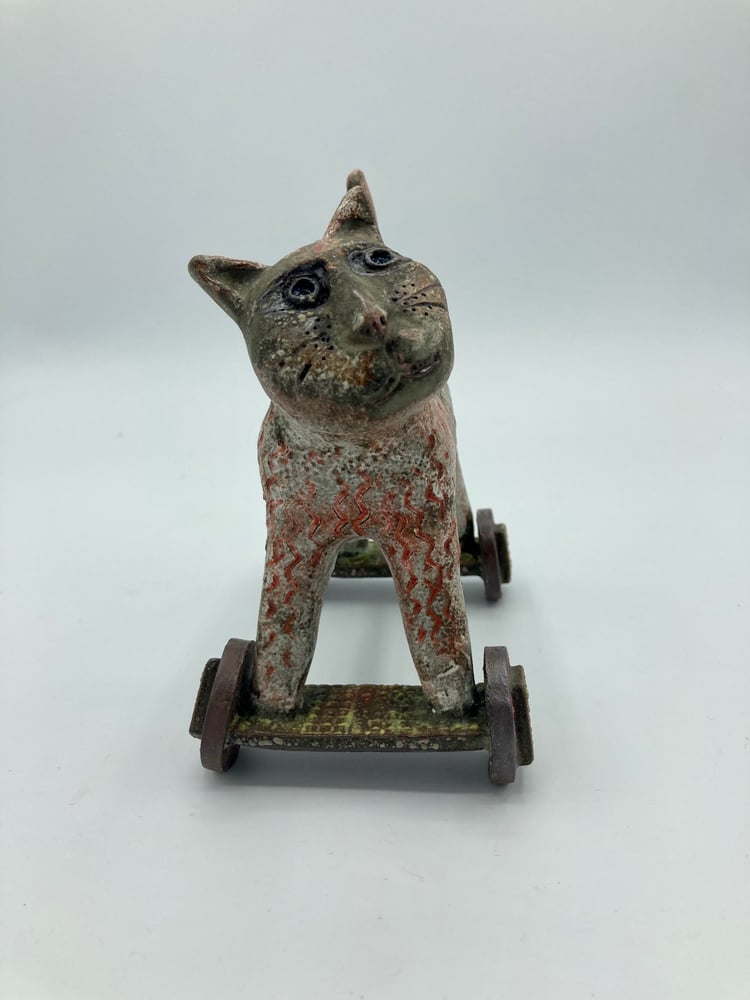 Image of Curious Cat on Wheels