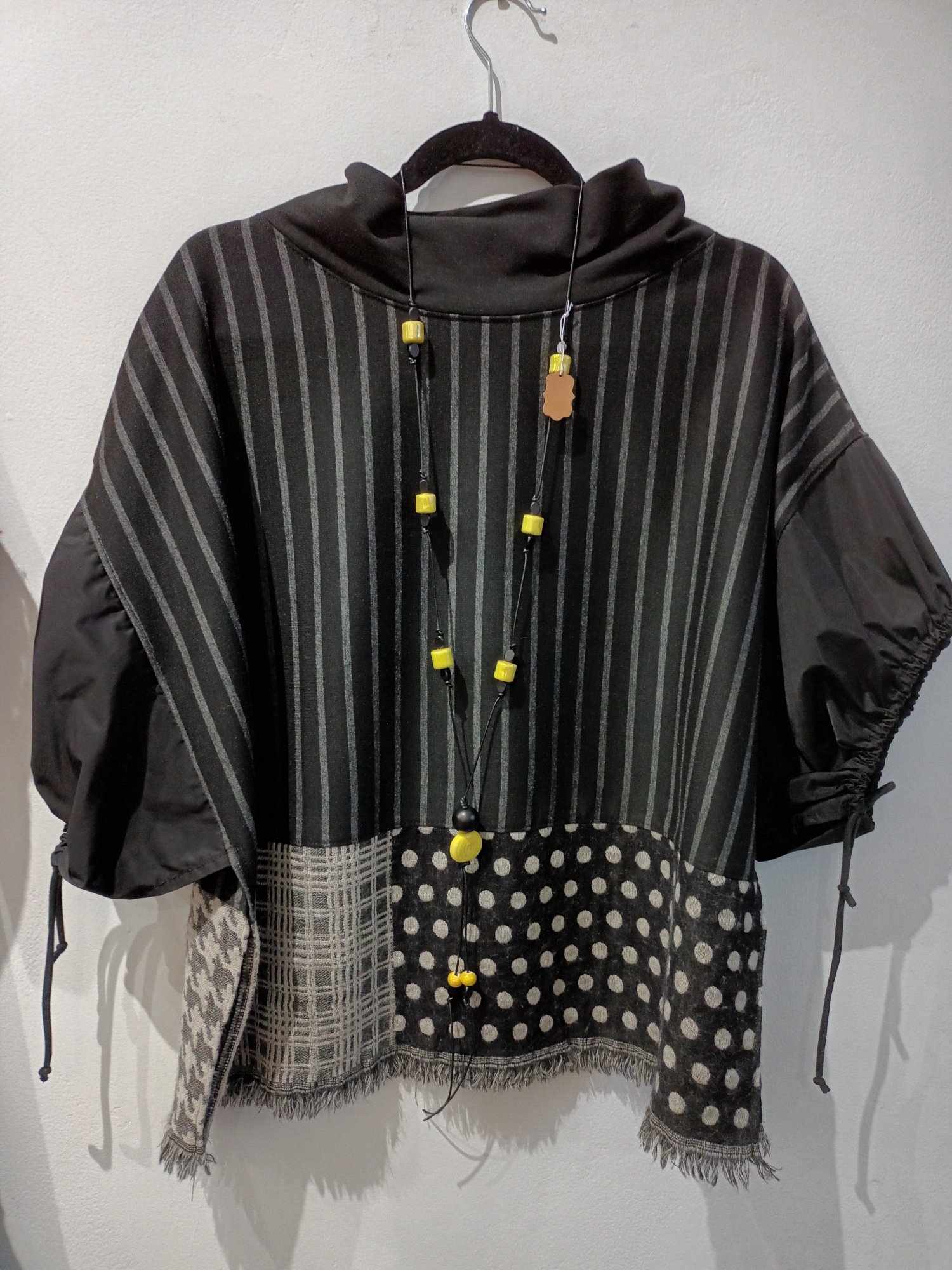 Image of black and grey/beige top