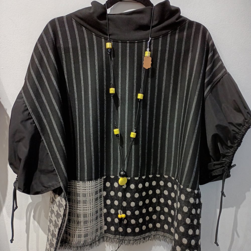 Image of black and grey/beige top