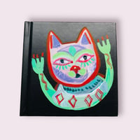 Black sketchbook with funny cat