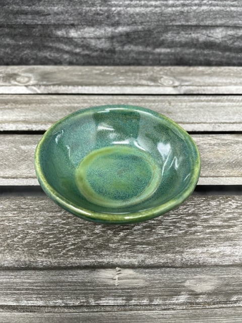 Image of Pouring Green Mug with tea dish
