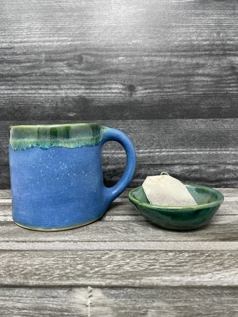 Image of Pouring Green Mug with tea dish