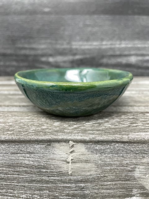 Image of Pouring Green Mug with tea dish