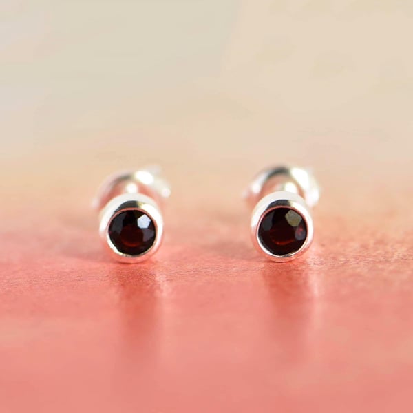 Image of Wine Red Garnet round cut silver stud earrings