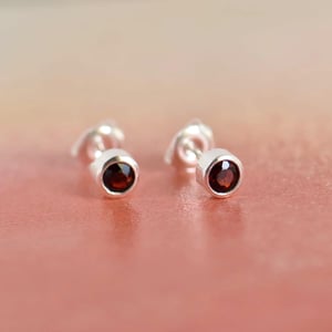 Image of Wine Red Garnet round cut silver stud earrings