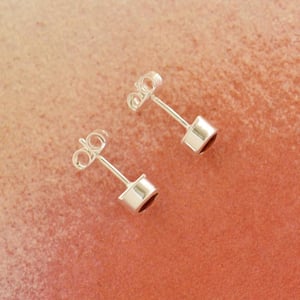 Image of Wine Red Garnet round cut silver stud earrings